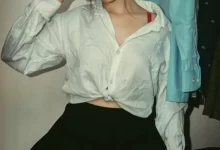 woman in white button up shirt and black skirt