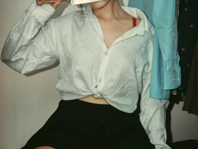 woman in white button up shirt and black skirt