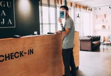 man standing beside counter