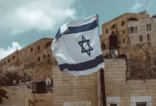 blue and white flag on pole