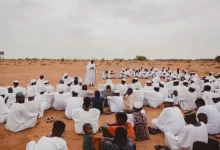 Group of People Gathering in the Desert