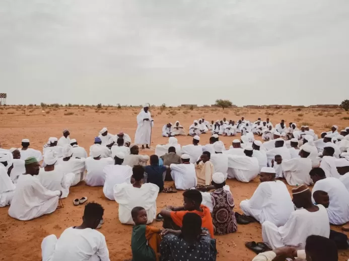 Group of People Gathering in the Desert