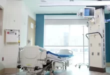 Hospital Bed Near the Glass Window