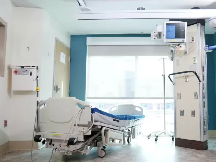 Hospital Bed Near the Glass Window