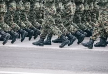 men in green and brown camouflage uniform