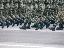 men in green and brown camouflage uniform