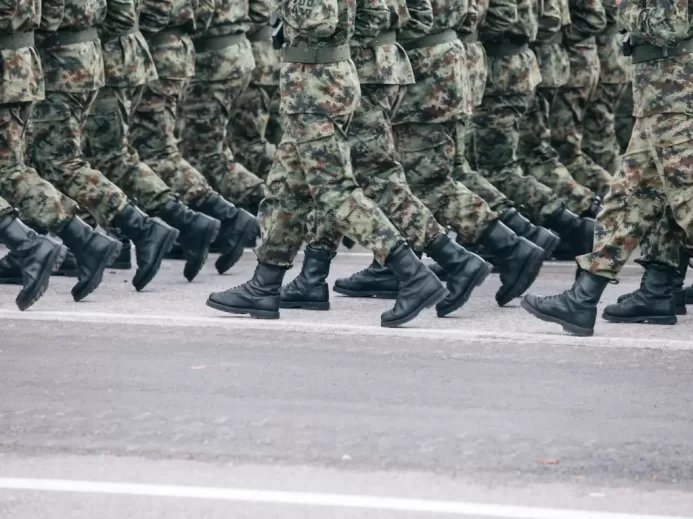 men in green and brown camouflage uniform