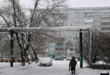 a person walking down a snow covered street
