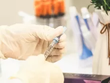 person holding white and black pen