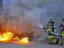 Firefighters attacking a fire