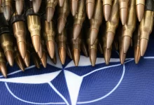 a bunch of bullet like objects on a blue background