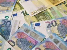 20 euro bill on white and blue textile