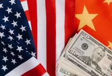American and Chinese flags and USA dollars