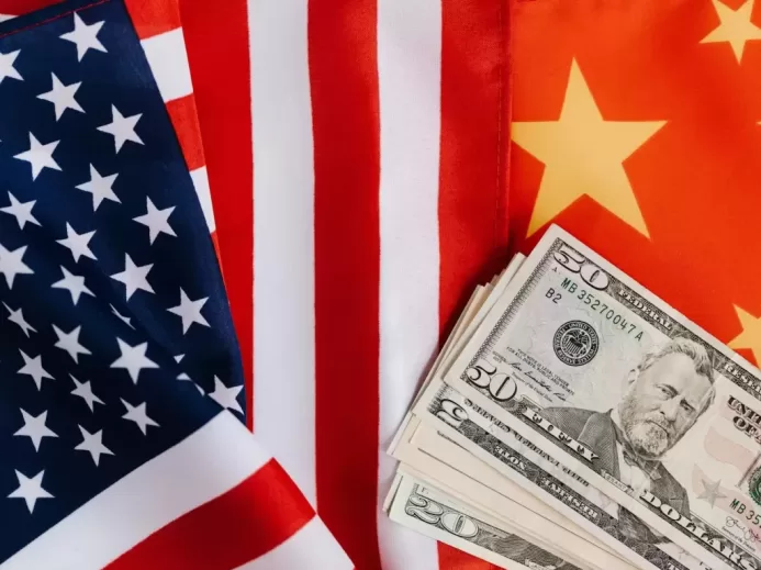 American and Chinese flags and USA dollars