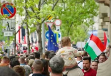 a crowd of people walking down a street