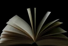 white book page with black background