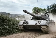 battle tank on green grass field during daytime