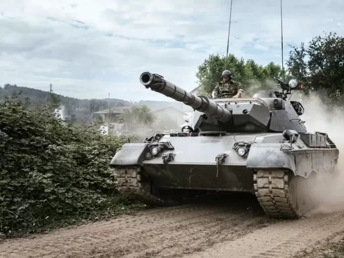 battle tank on green grass field during daytime