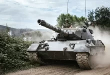 battle tank on green grass field during daytime