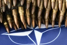 a bunch of bullet like objects on a blue background