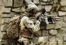 military hiding on wall