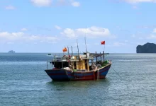 a boat floating on top of a large body of water
