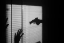 silhouette of person on window