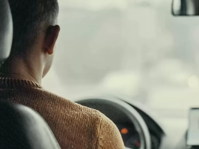 man driving vehicle