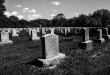 a black and white photo of a cemetery