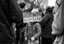 Child Holding a Placard