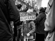 Child Holding a Placard