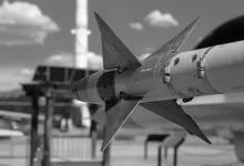 Grayscale Photo of Airplane in Missile