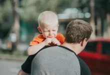Man Carrying Child