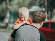 Man Carrying Child