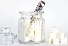 Close-Up Photo of Sugar Cubes in Glass Jar