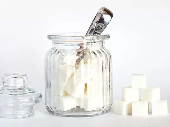 Close-Up Photo of Sugar Cubes in Glass Jar