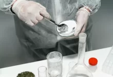A Person Testing Powder in a Laboratory