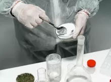 A Person Testing Powder in a Laboratory