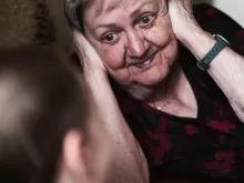 woman covering her ears photo
