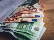 euro banknote collection on wooden surface