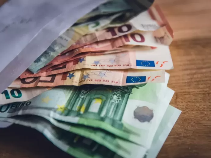 euro banknote collection on wooden surface