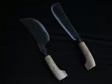 a couple of knives sitting next to each other