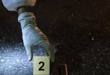 Forensics Investigator Marking Evidence Number 2 a Cigarette Case