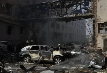 Building and Car Damaged by Fire 