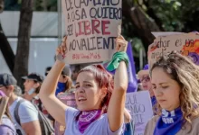 Woman at Protest Holding Board