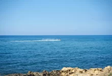 Person Riding Jet Ski on the Sea