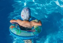 woman in blue swimming cap in pool