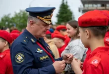 Military Man Talking to Students