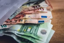 euro banknote collection on wooden surface