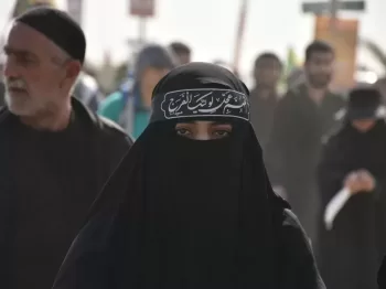 group of people in black walking